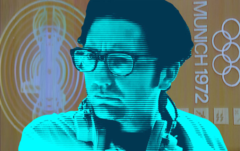 John Magaro as Geoffrey Mason in September 5. The picture has been altered to resemble an old television image.