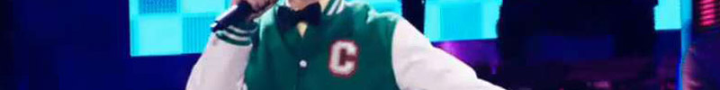 Conner 4 Real's upper torso, wearing a green and white letterman's jacket with a white C on the left breast.